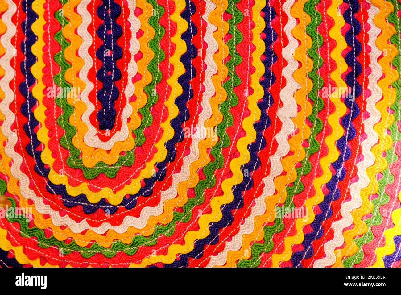 Details shot of indian carpet (fabric) with colorful pattern, Colorful