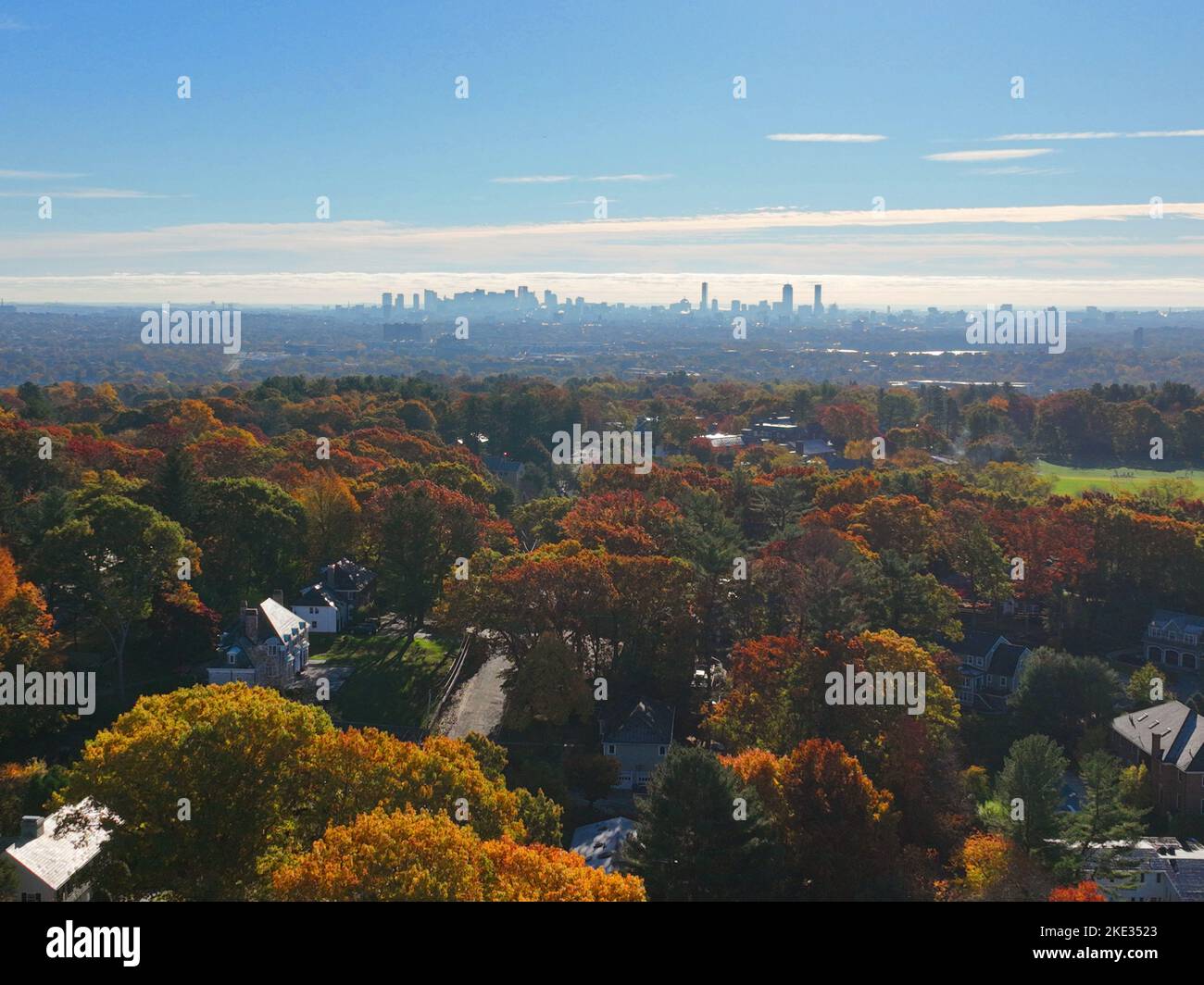 Belmont suburban landscape aerial view in fall with Boston modern city skyline in town of Belmont, Massachusetts MA, USA. Stock Photo