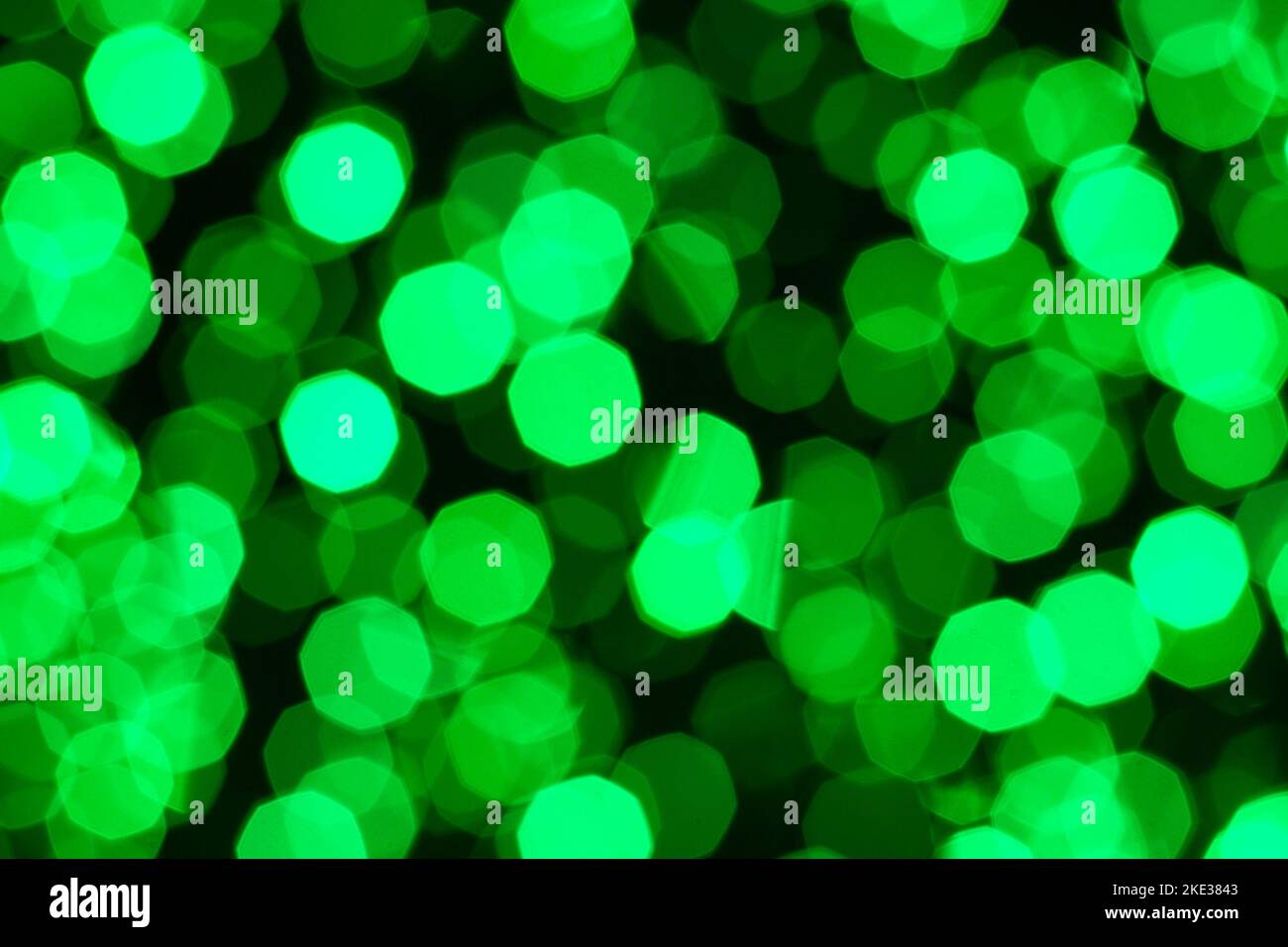 Defocused christmas green abstract bokeh lights background. Festive lights. Blurred holiday bokeh. Stock Photo