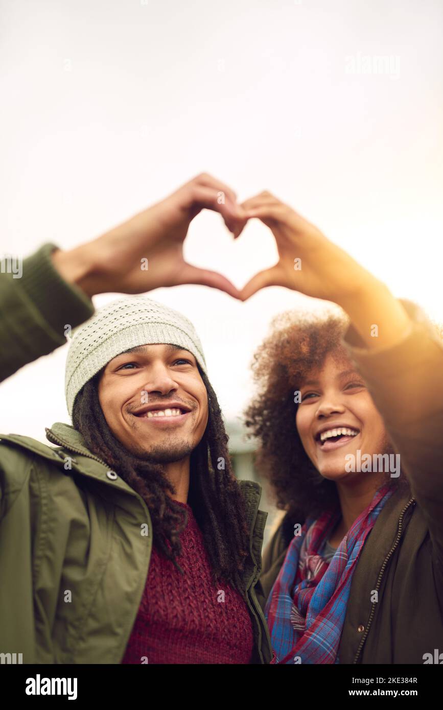 Youve Taught Me The True Meaning Of Love. A Couple Forming A Heart Shape  With Their Hands While Sitting On The Beach. Stock Photo, Picture and  Royalty Free Image. Image 198911221.