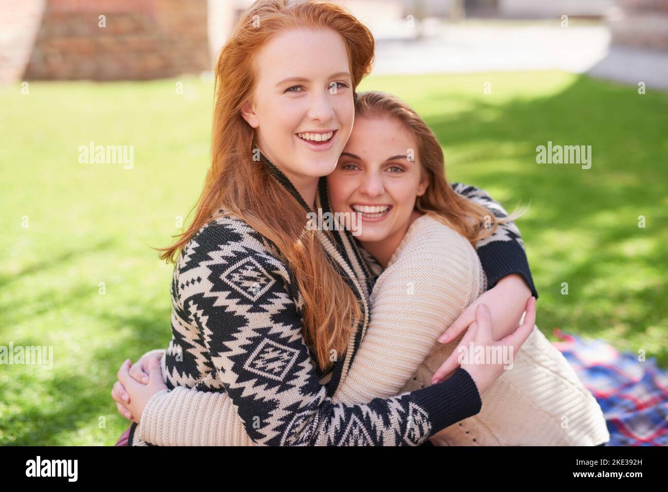 My bestie gives the best hugs ever. two happy friends hugging outdoors. Stock Photo