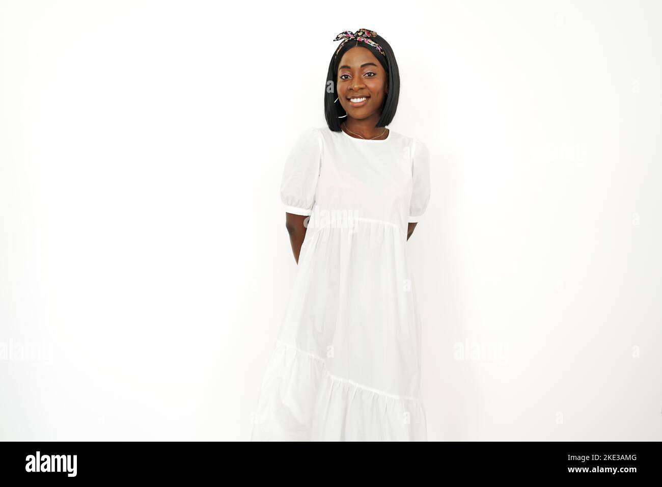 Beautiful young african woman posing over white background Stock Photo ...