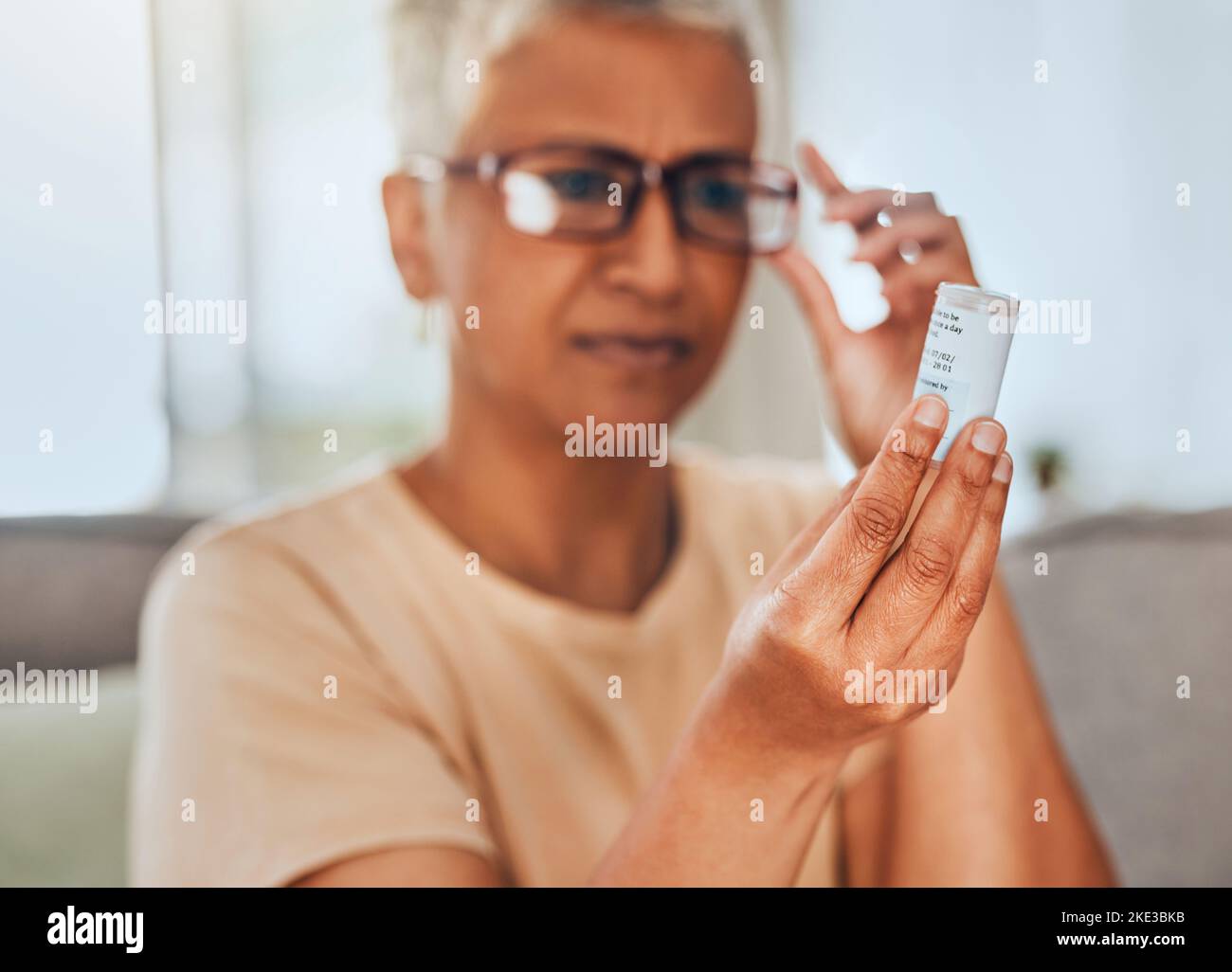 Glasses, medicine and pills senior woman reading information for