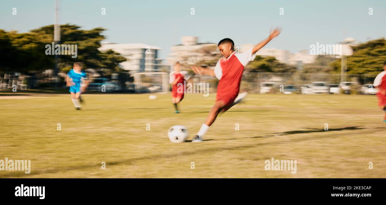 Sports game, soccer and child shooting, kick or strike ball to score winning goal in contest, competition or match
