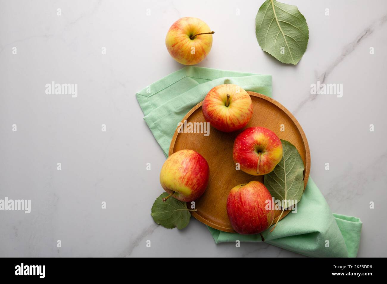 Overhead view of apples on light marble table food fruits copy space Stock Photo