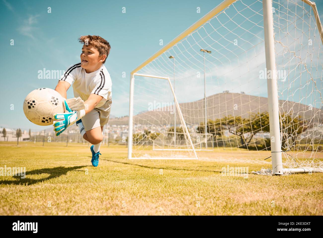 Kid saving goal football hires stock photography and images Alamy