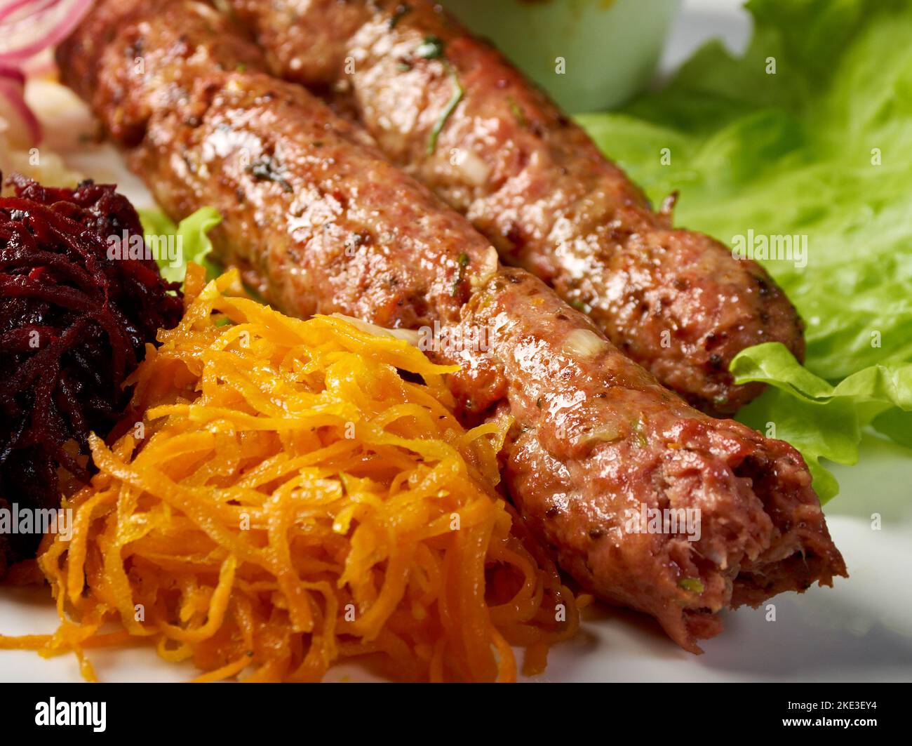 Kebab Halabi ground beef kebab with a tomatoonion reduction, common