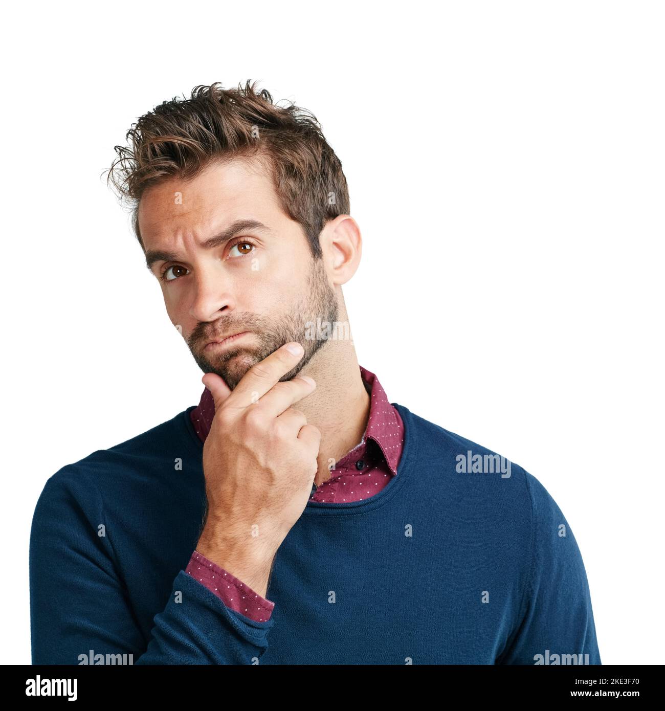 Work that mental muscle. Studio shot of a man looking unsure against a white background. Stock Photo