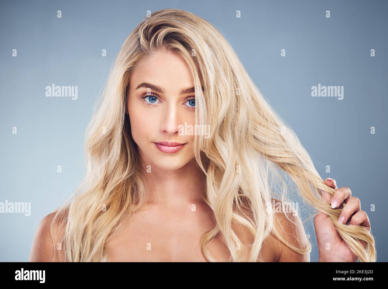 Woman, blonde, hair care on gray studio background in hair dye