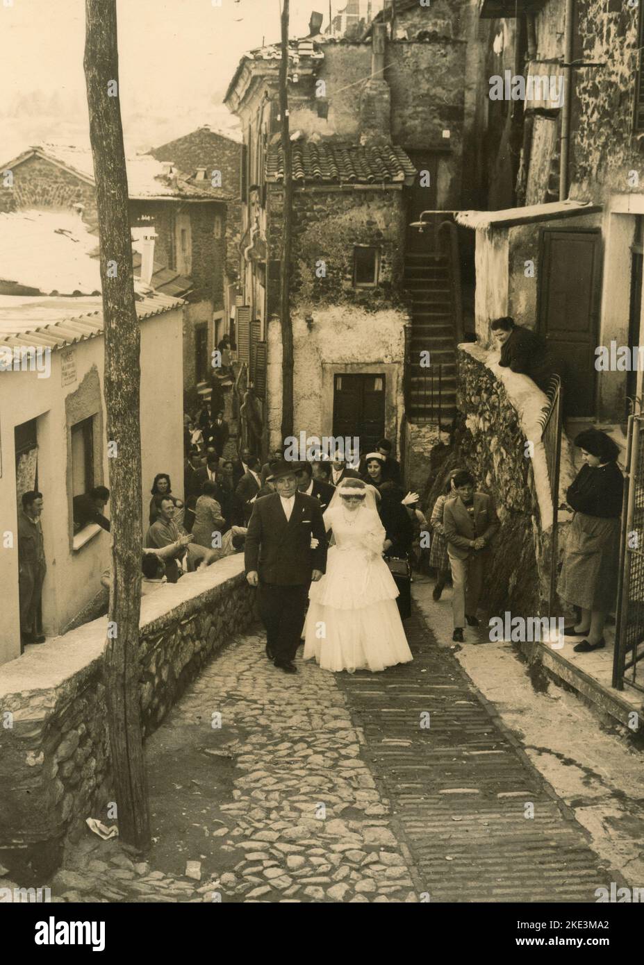 Wedding in a village in central Italy: The Bride in the streets accompained by her dad, 1950s Stock Photo