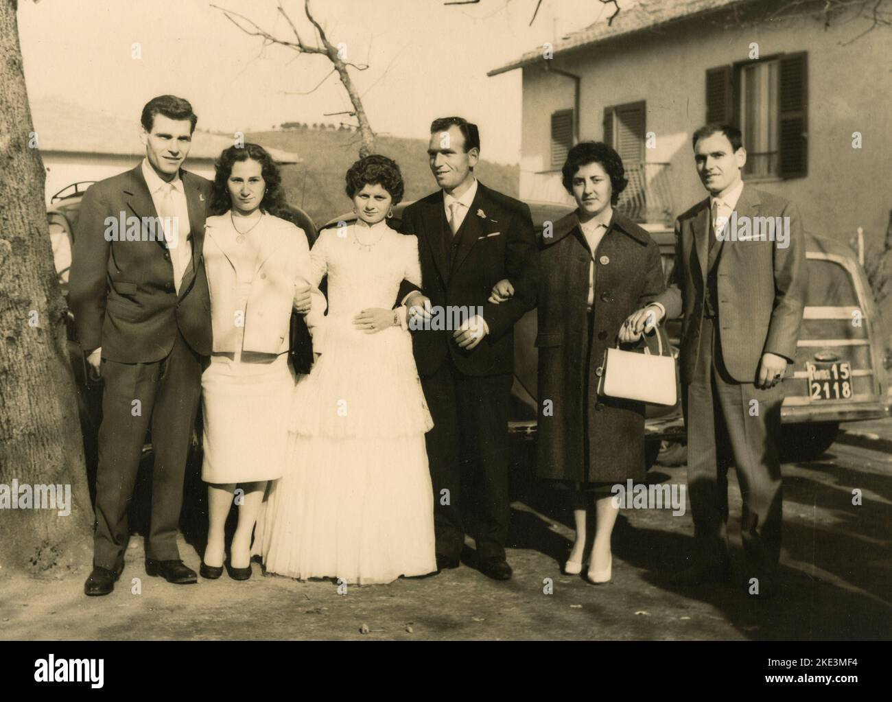 Wedding in a village in central Italy: The Bride and the Groom taking photos with friends and relatives, 1950s Stock Photo