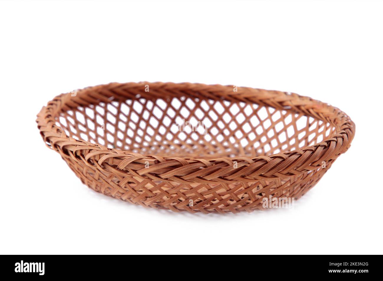 Empty wicker basket isolated on white background Stock Photo - Alamy