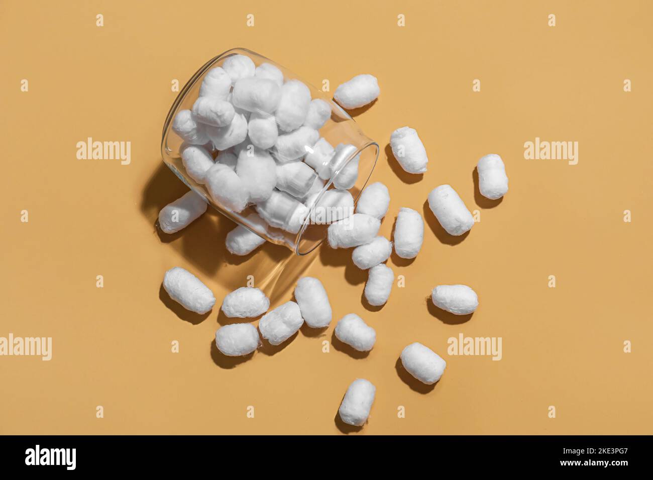 Jar of soft cotton balls on color background Stock Photo - Alamy