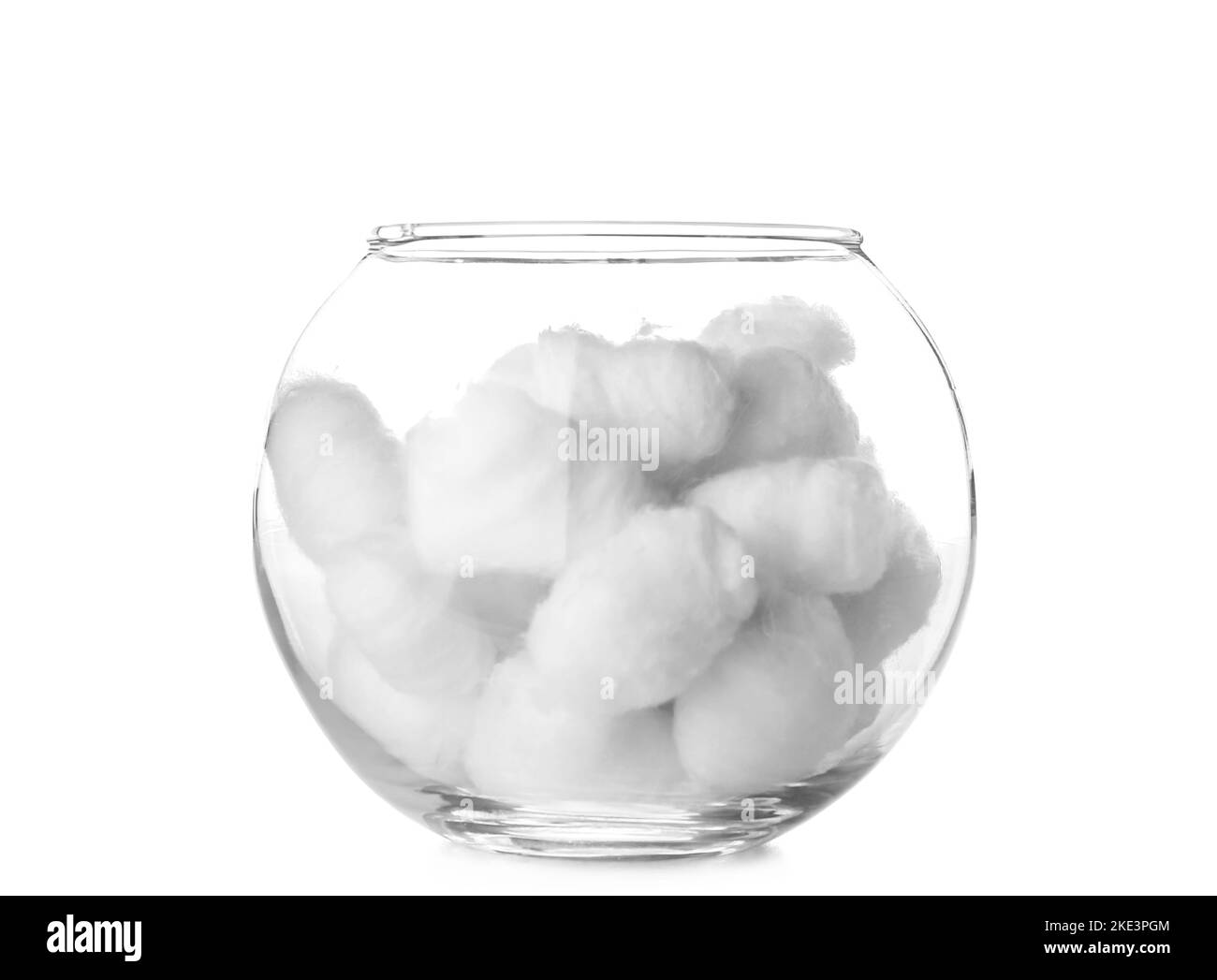 Bowl of soft cotton balls on white background Stock Photo