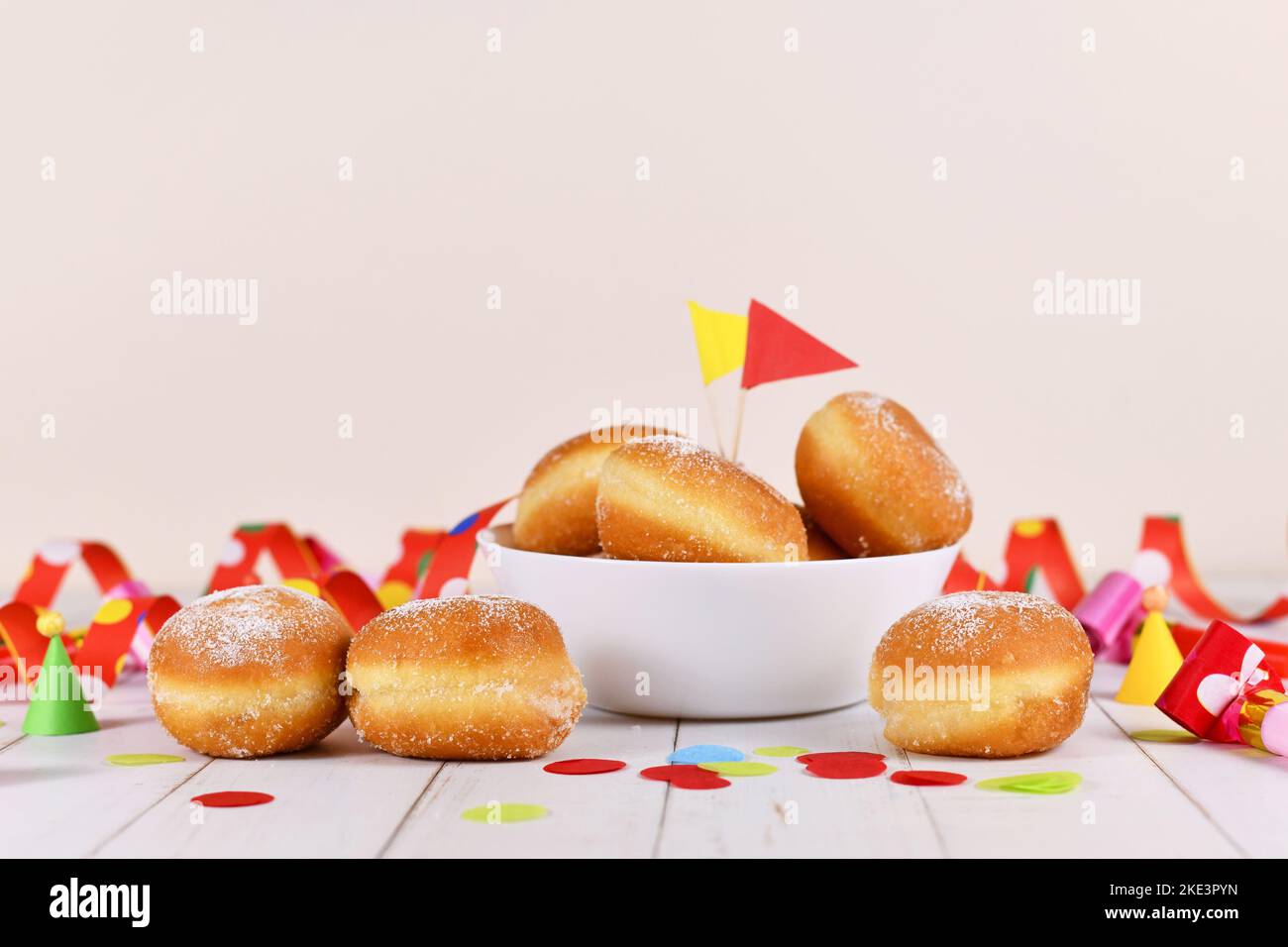 German traditional 'Berliner Pfannkuchen', a donut without hole filled with jam. Traditional served during carnival. Stock Photo