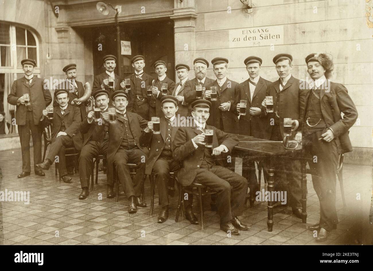 Group of postmen toasting with the beer at a local hunters party, Germany 1920s Stock Photo