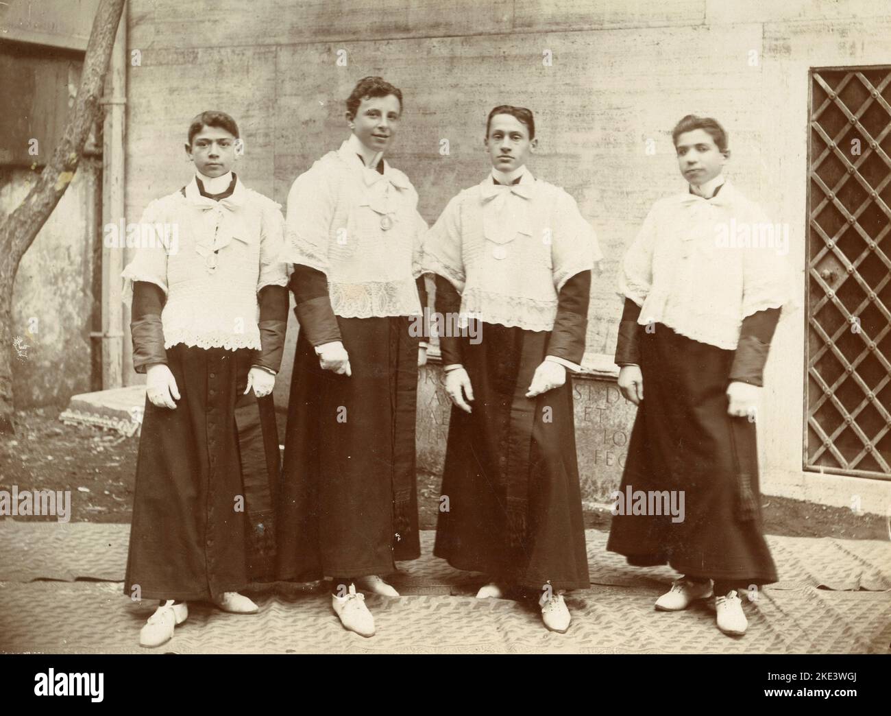 Four altar boys out of the church of Istituto Massimo, Rome, Italy 1904 Stock Photo