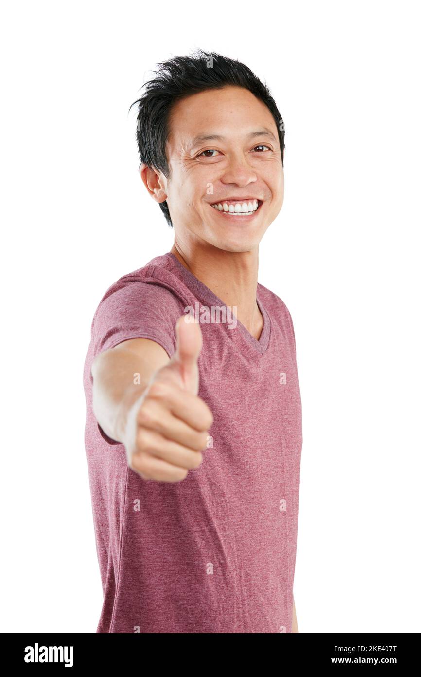 Youve got my vote. Studio portrait of a young man standing and giving a thumbs up against a white background. Stock Photo