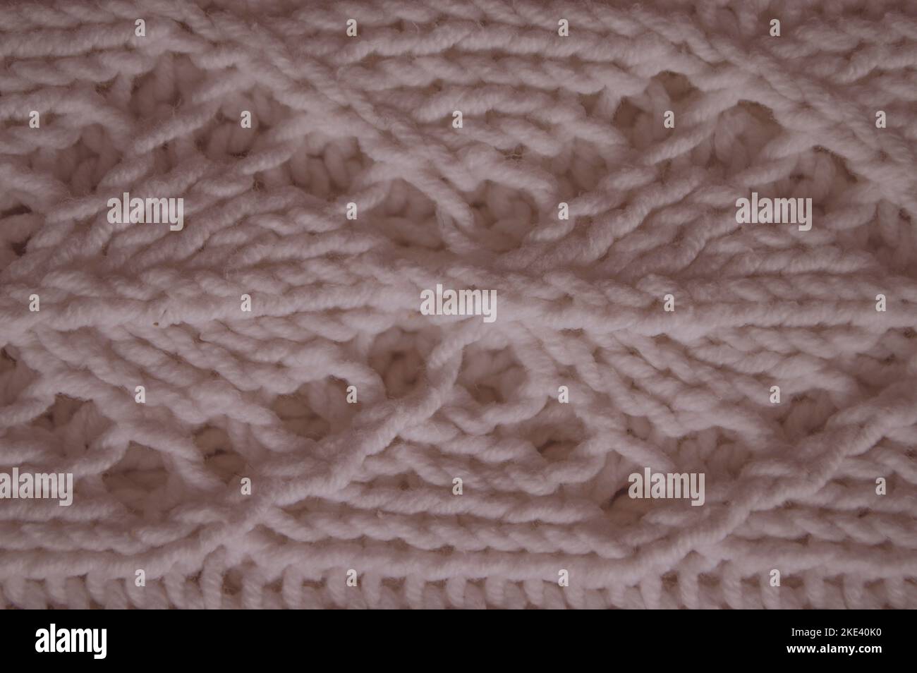 Organic knitted background with macro woven threads. Stock Photo