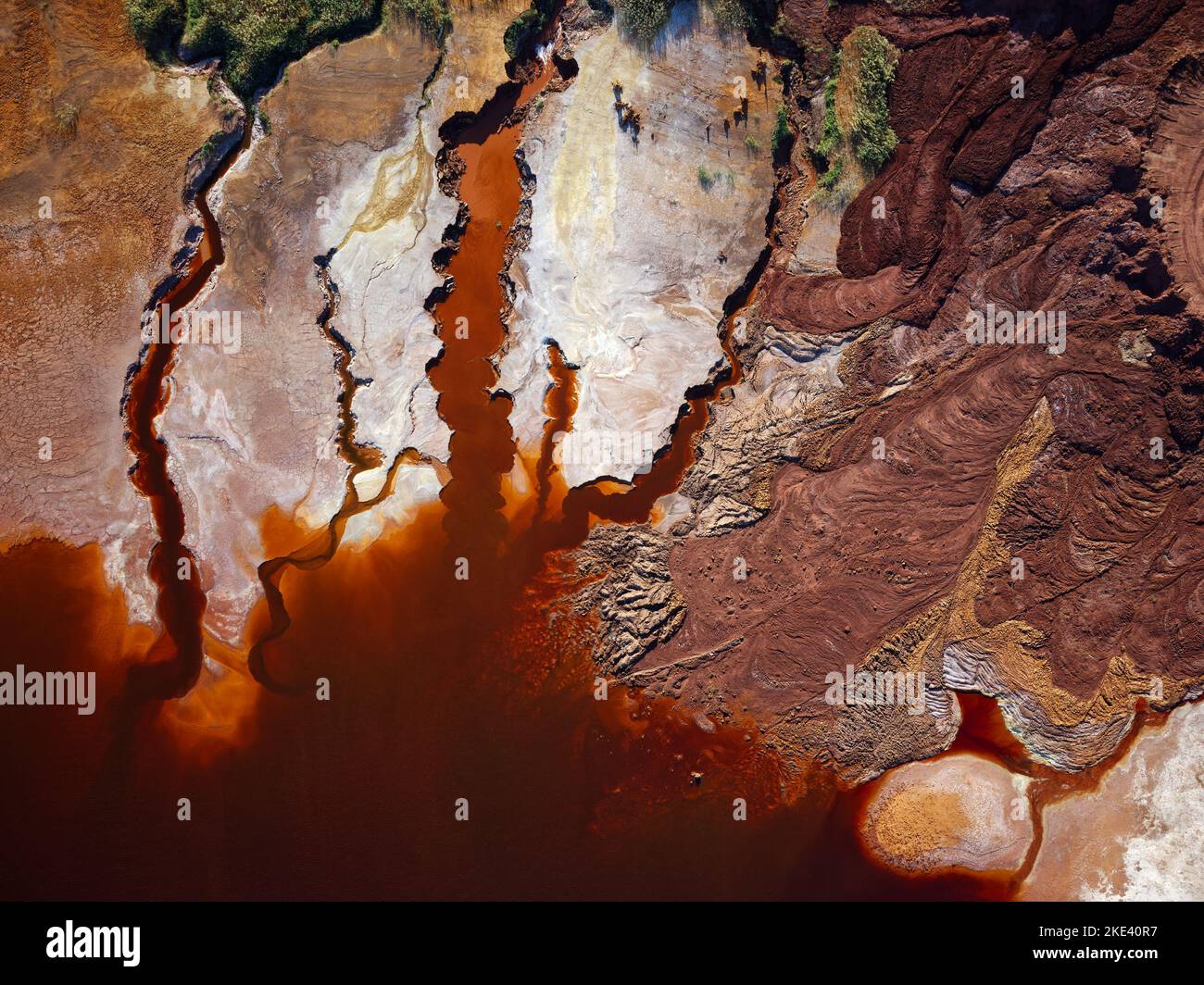 Aerial drone view of Mining activity in Minas de Riotinto in Spain. Polluted river, red color of water. Apocalypse scenery. Destruction of nature. Stock Photo