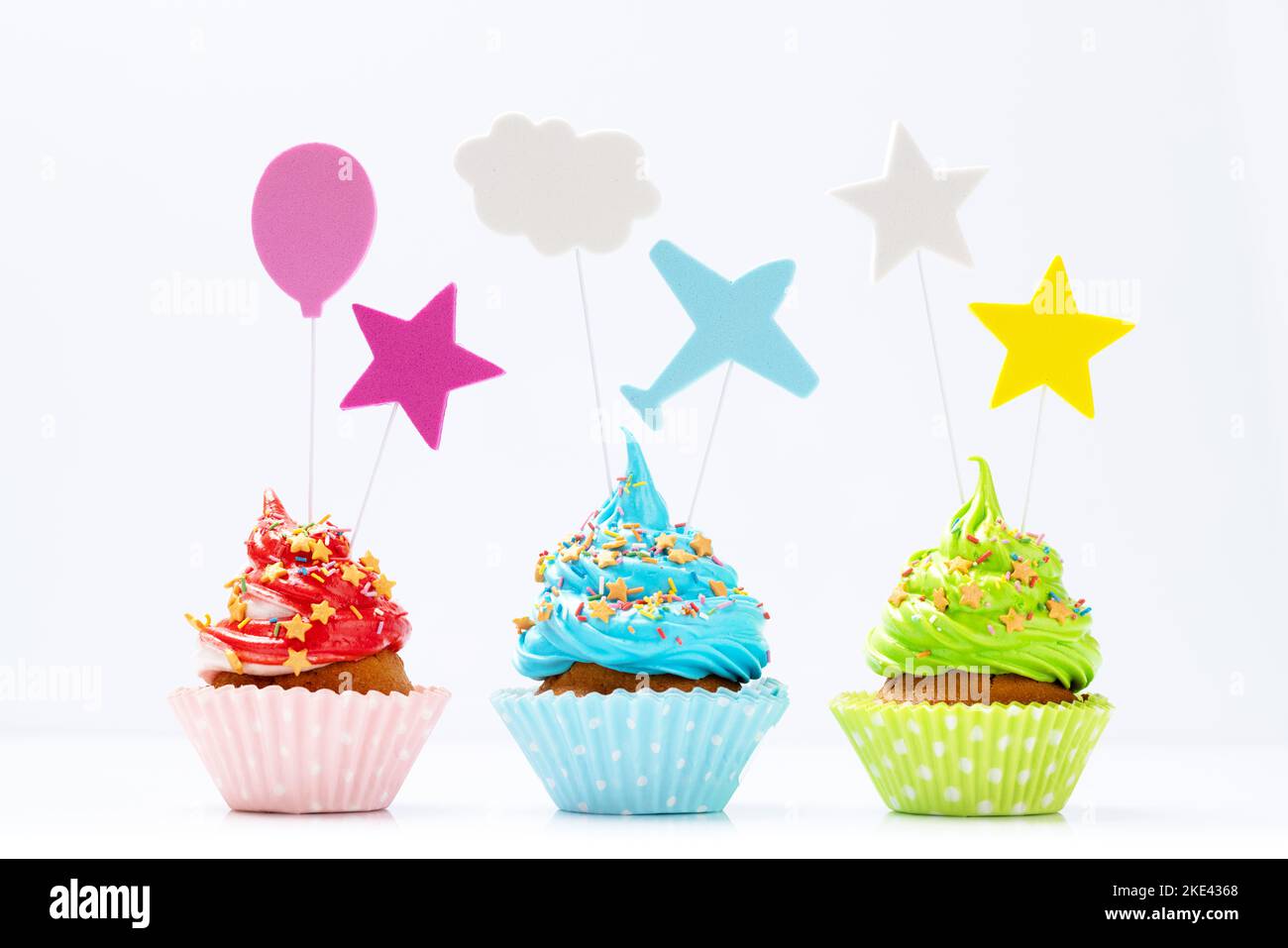 Colorful cupcakes isolated on white background Stock Photo