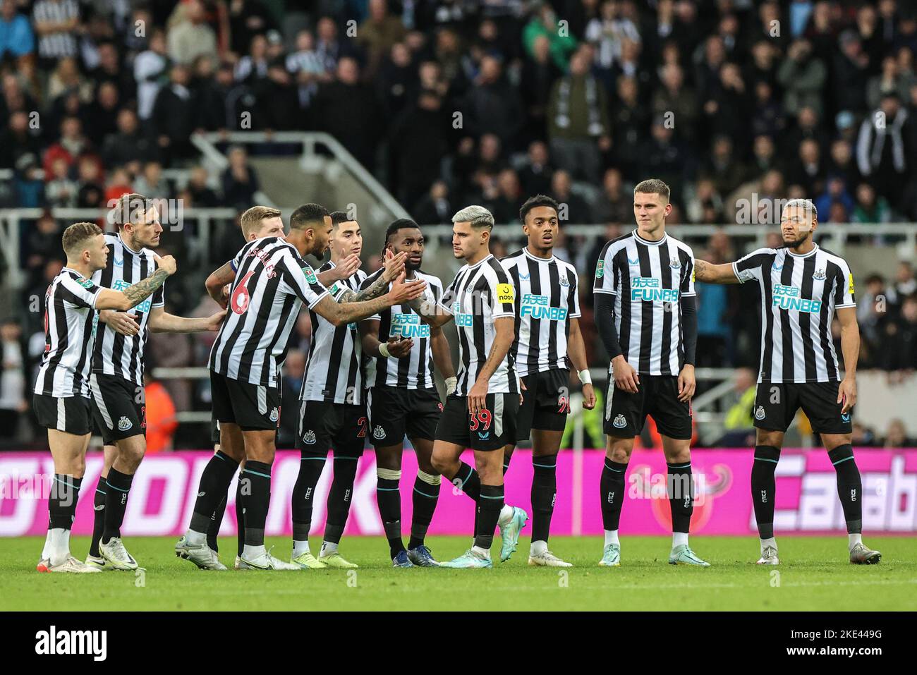 Bruno Guimarães #39 of Newcastle United’s team mates shakes his hand after Guimarães misses his penalty during the Carabao Cup Third Round match Newcastle United vs Crystal Palace at St. James's Park, Newcastle, United Kingdom, 9th November 2022  (Photo by Mark Cosgrove/News Images) Stock Photo