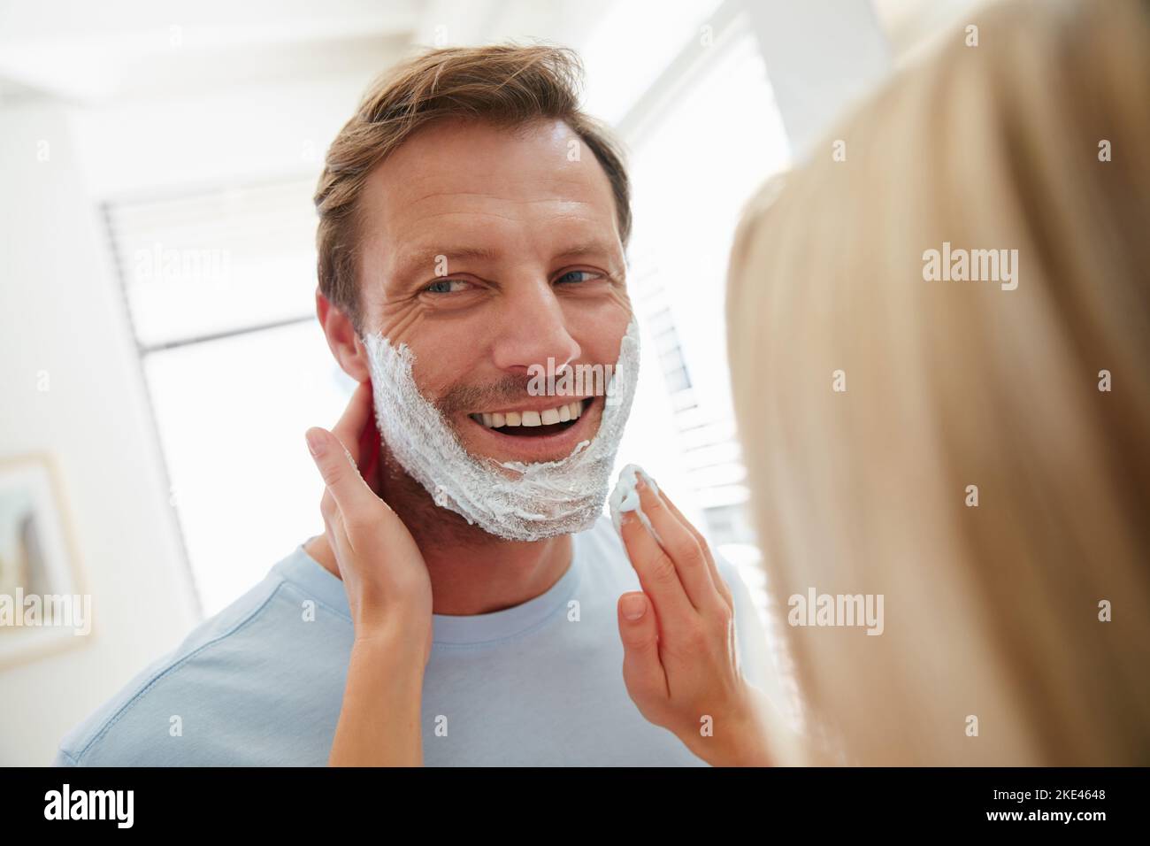Starting the day fresh and cleanshaven. a couple getting ready together in the bathroom Stock