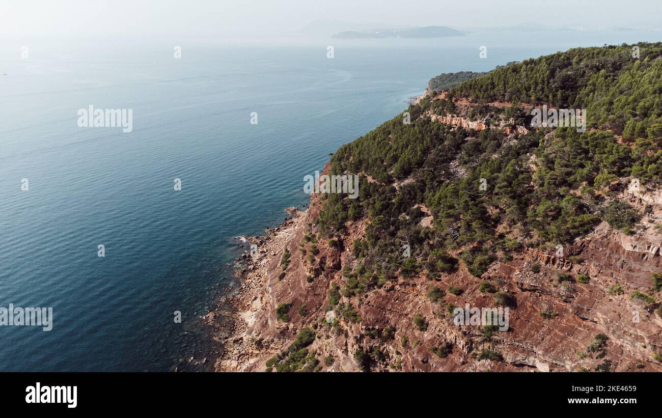 An aerial view of an island with green and overlooking blue ocean Stock ...