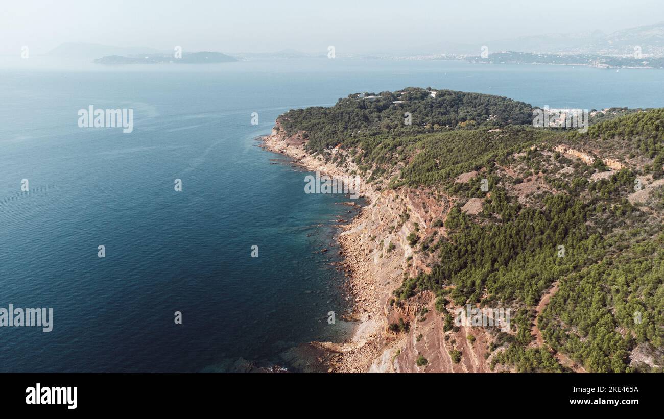 An aerial view of an island with green and overlooking blue ocean Stock ...