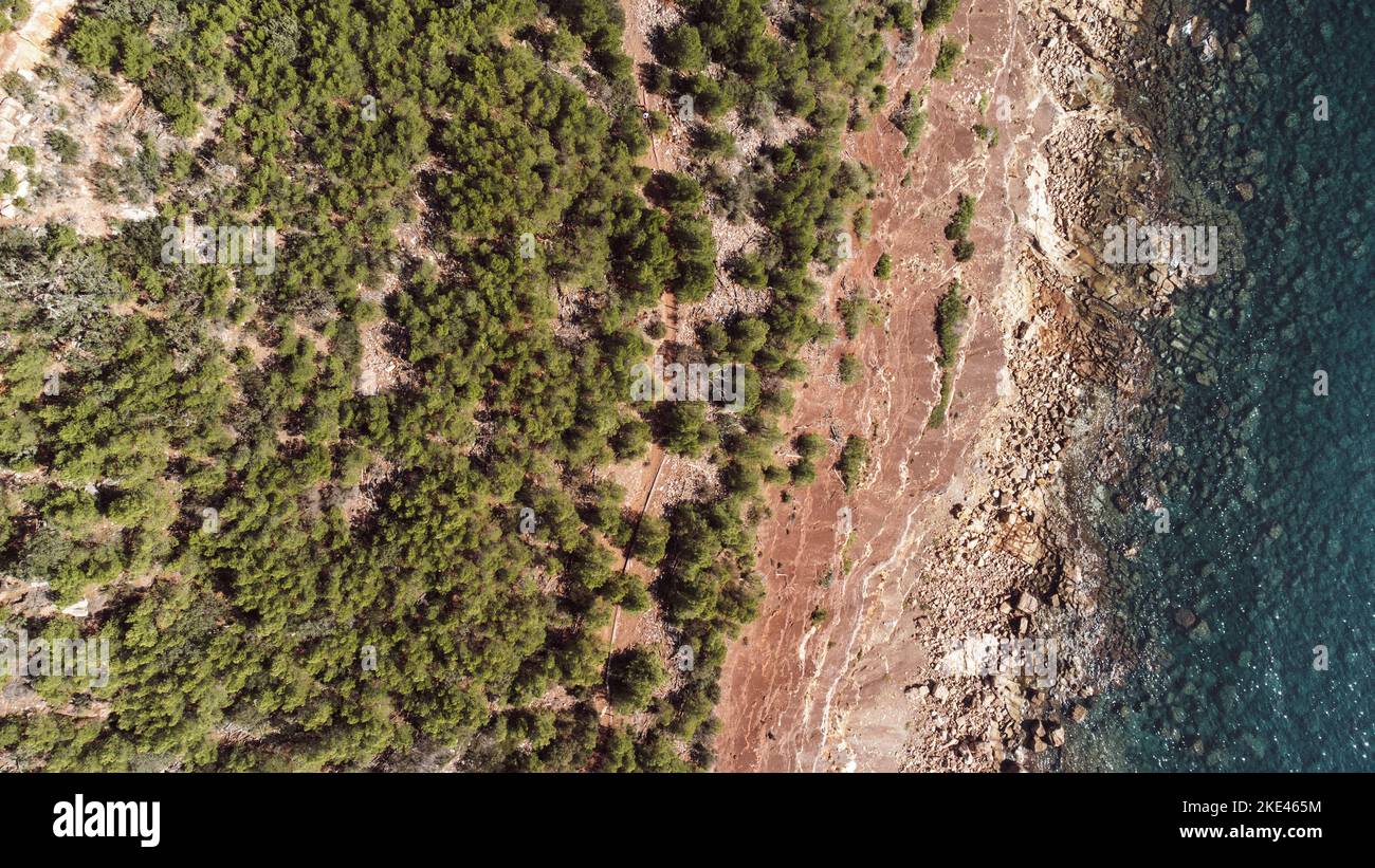An aerial view of an island with green and overlooking blue ocean Stock ...