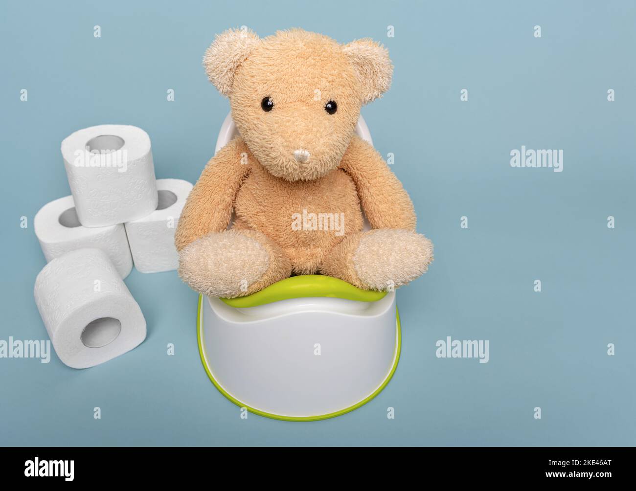Soft toy bear on a potty. Stock Photo