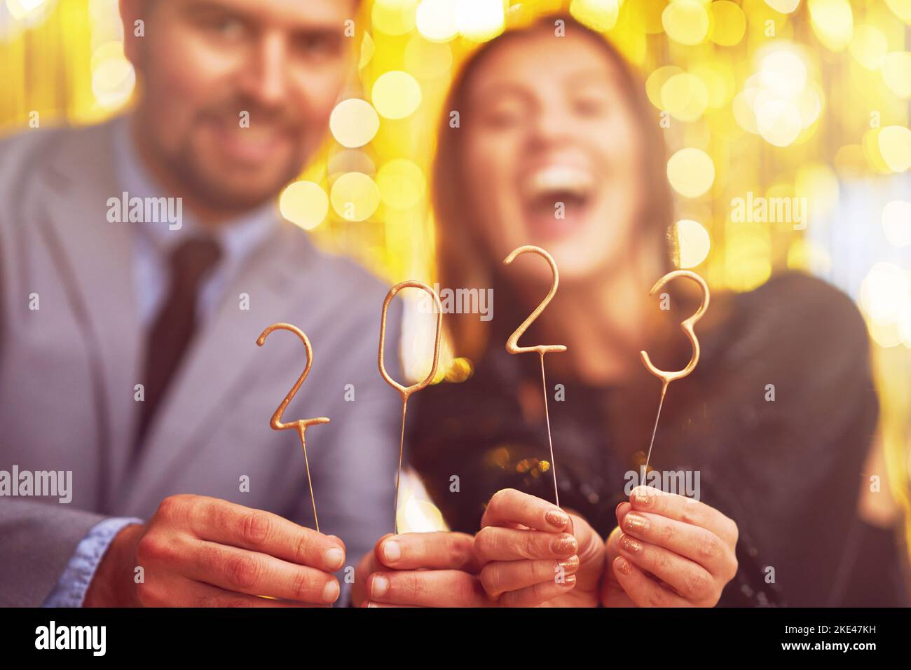 Couple at new year eve party with 2023 sparklers Stock Photo Alamy