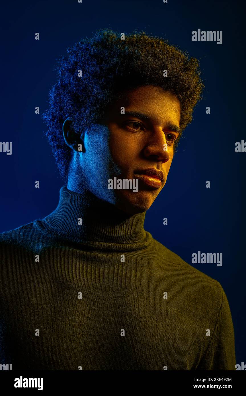 Young confident man posing for camera studio shot Stock Photo