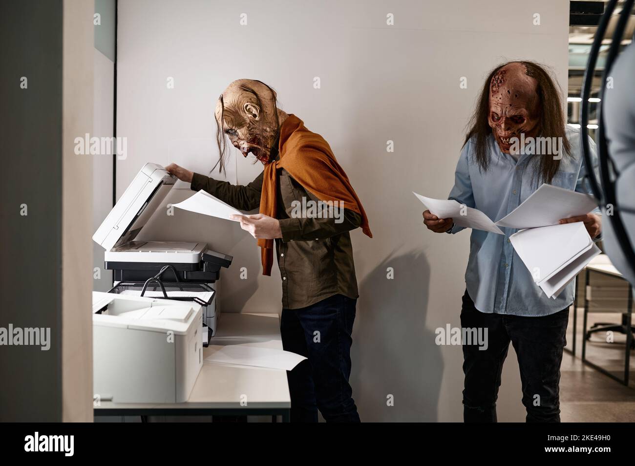 Zombies at copier in the office Stock Photo
