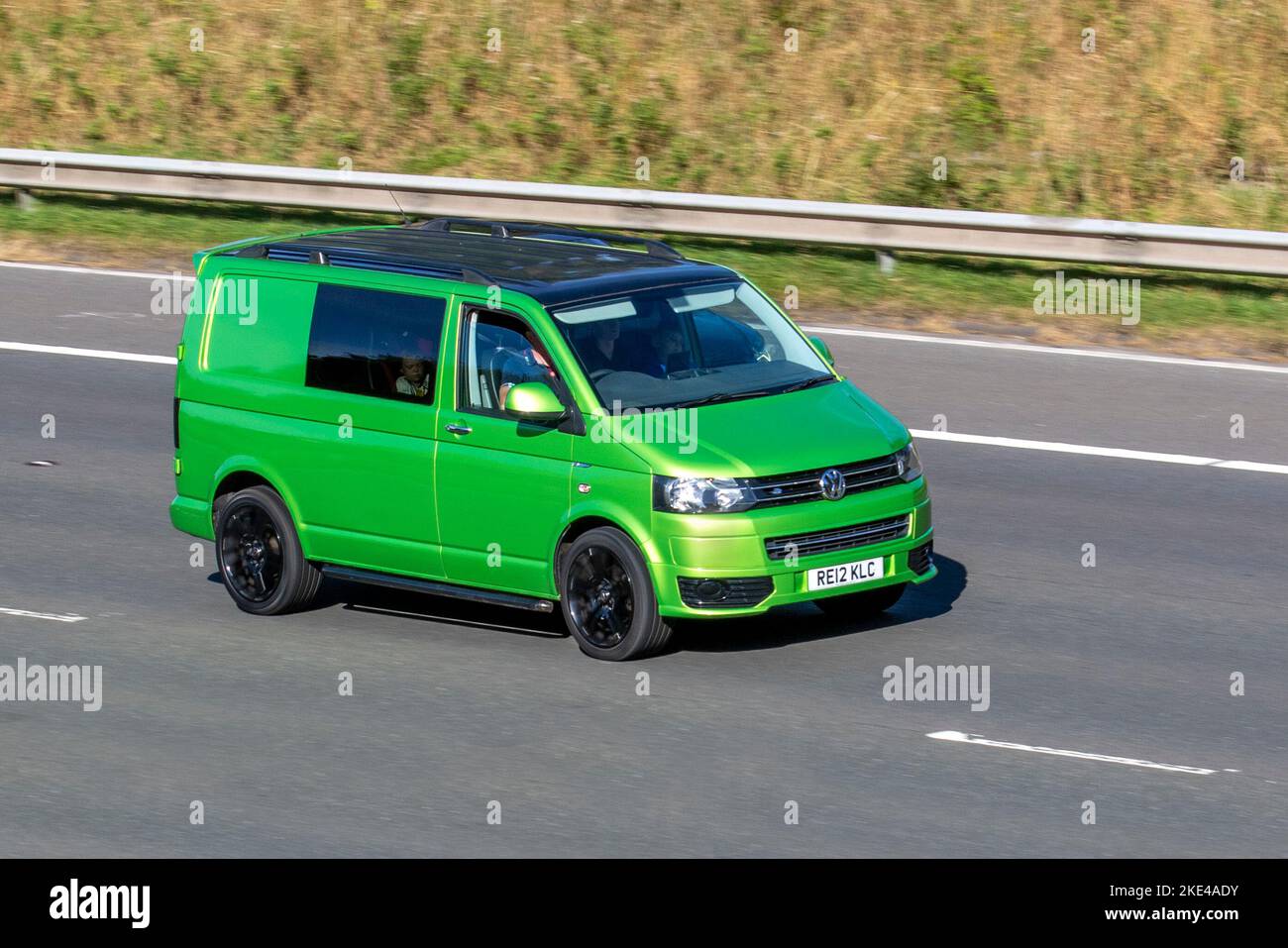 2021 Green VW Volkswagen Tdi 84 SWB LCV Panel Van travelling on the M6 motorway, UK Stock Photo