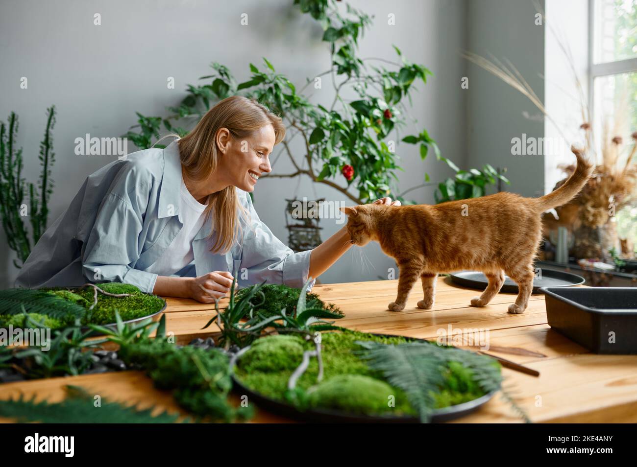 Young woman florist decorator working at workshop Stock Photo