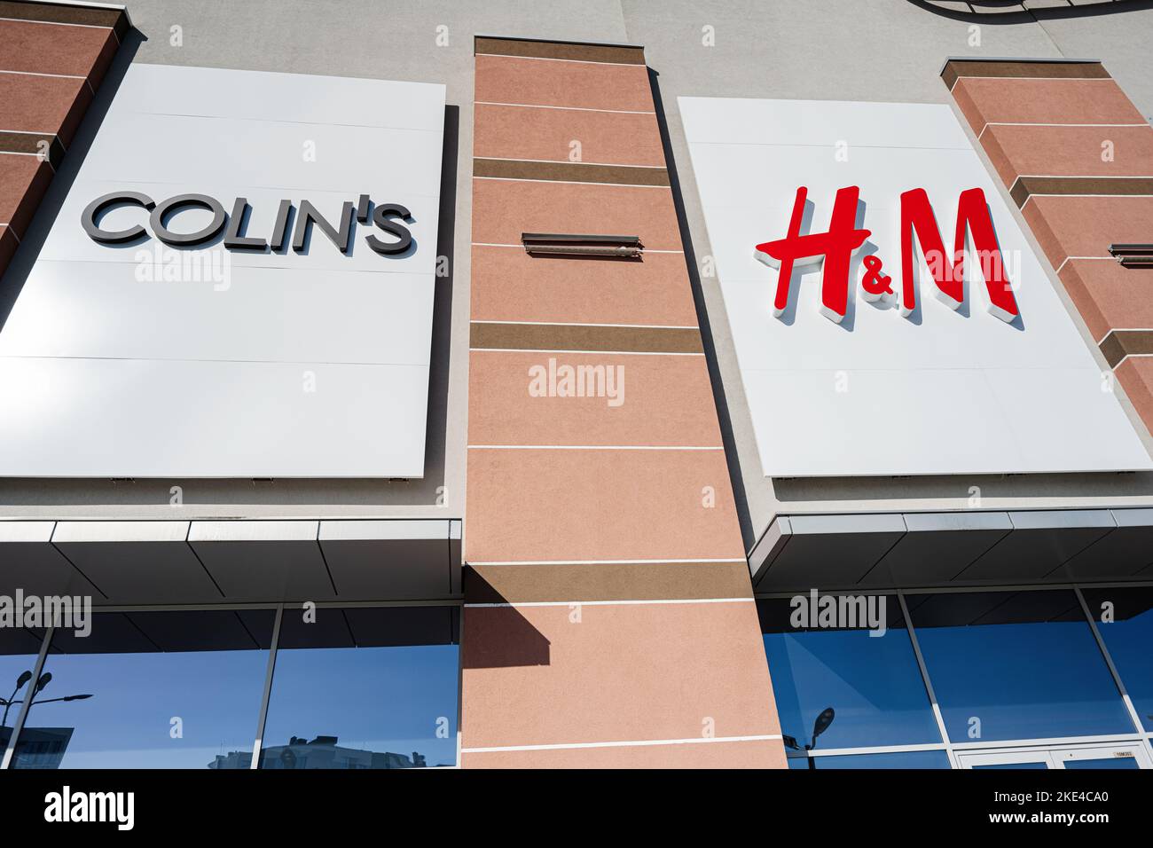 Lviv, Ukraine - October 09, 2022: Colin's and H&M logos in shopping mall center. Stock Photo