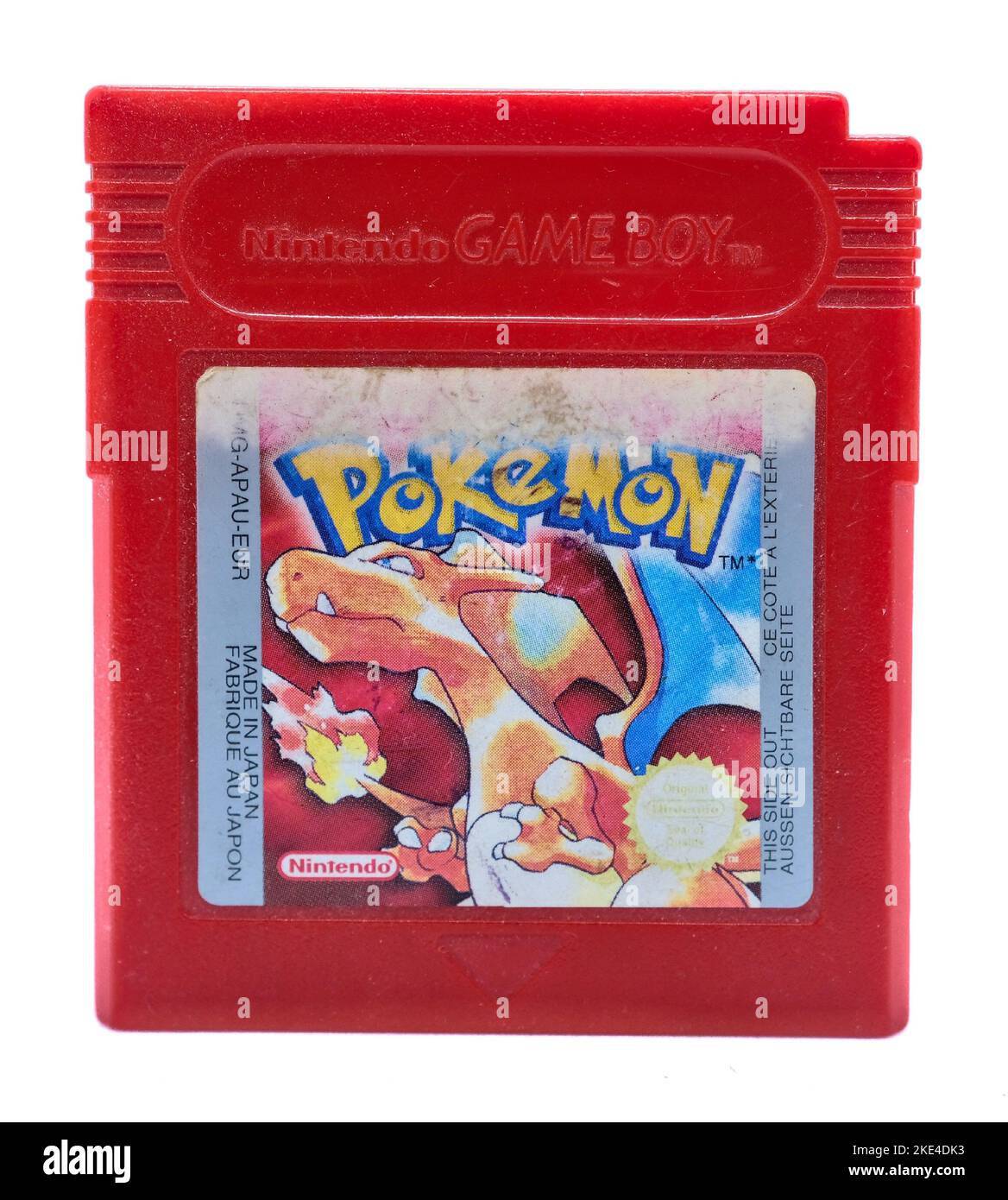 A Pokemon Red Version of Gameboy Color game chip on white background Stock Photo