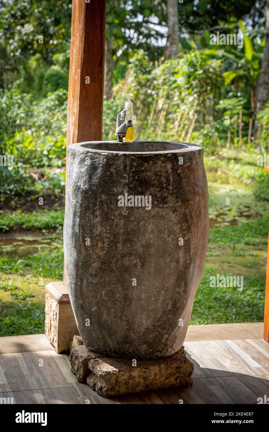 wash basin made of stone in the jungle of Indonesia Stock Photo Alamy