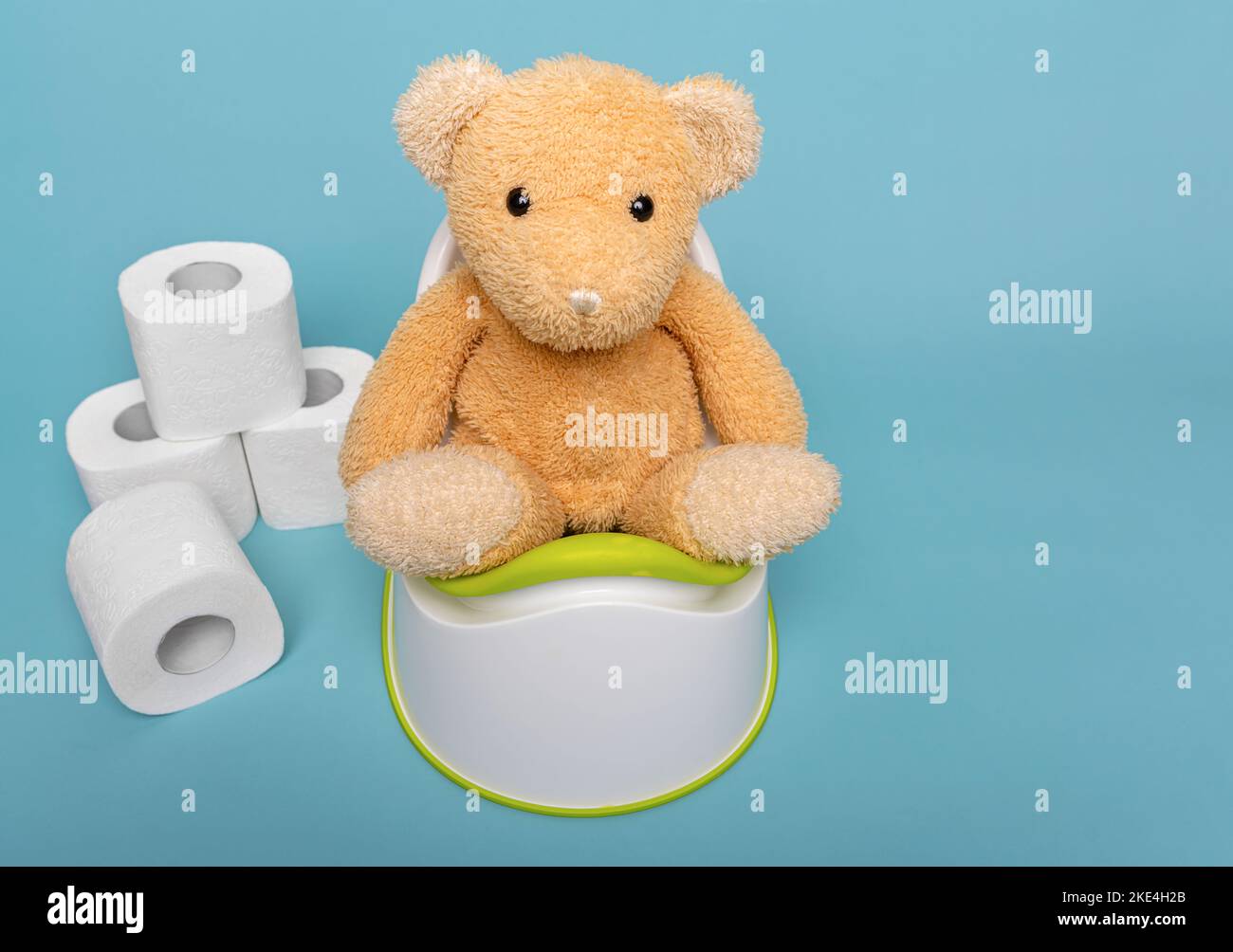 Soft toy bear on a potty. Stock Photo