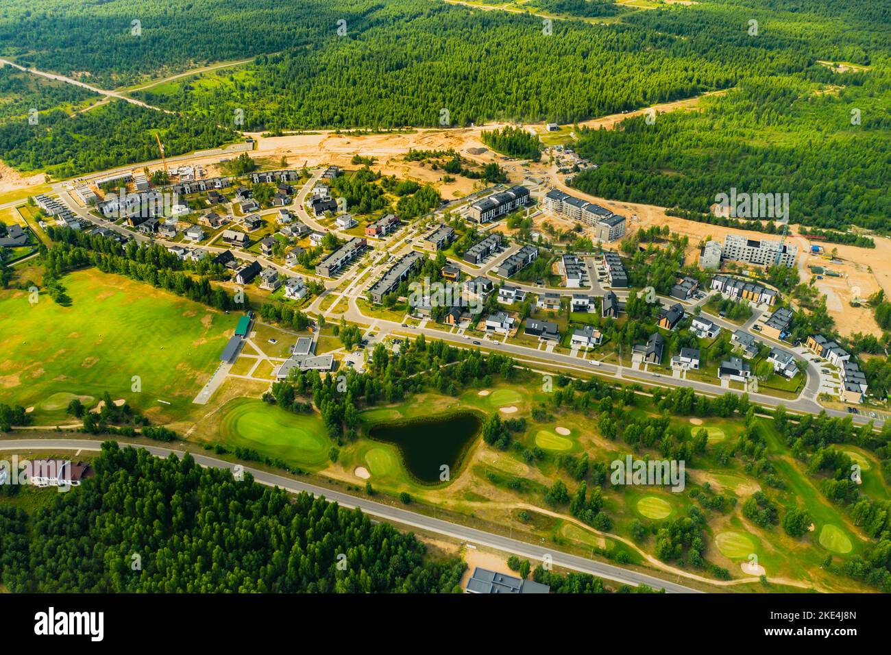 Top view of the golf course located in a wooded area Stock Photo