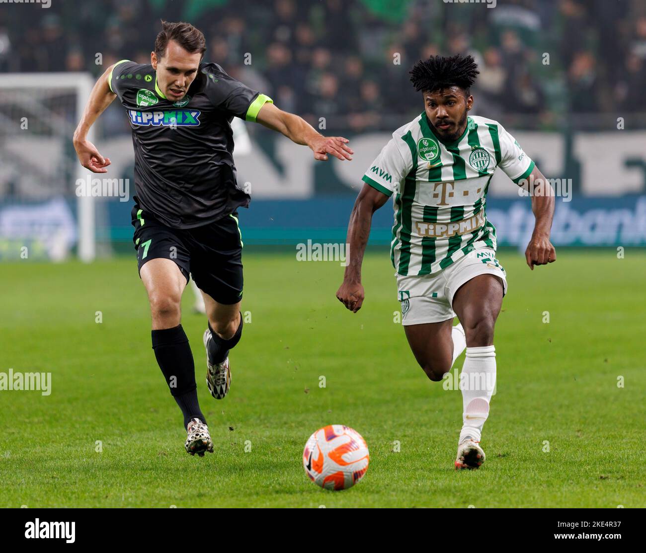 Petrus Boumal of Ujpest FC competes for the ball with Jose Marcos