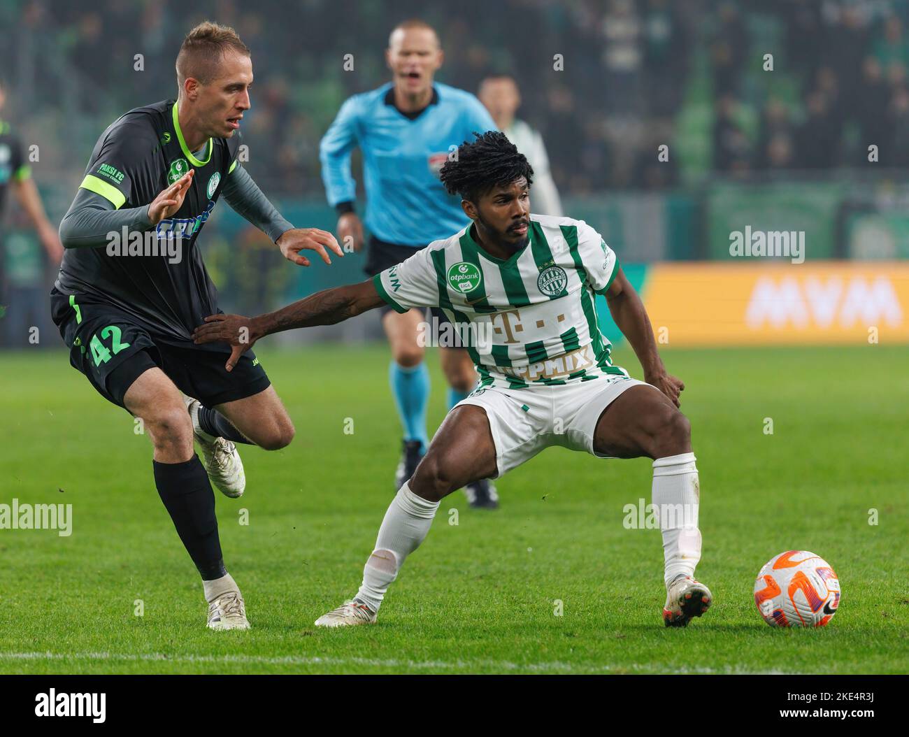 Petrus Boumal of Ujpest FC competes for the ball with Jose Marcos