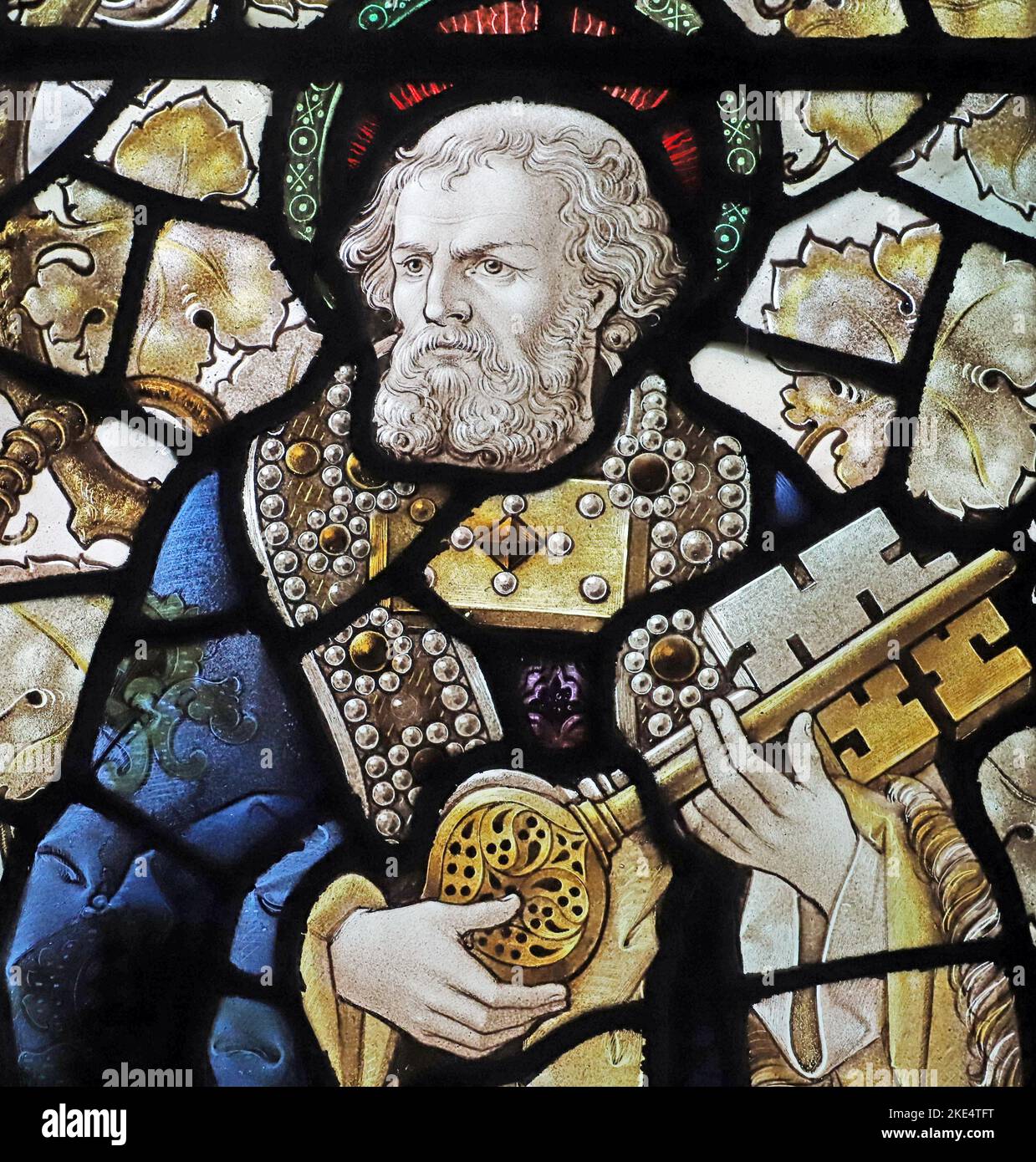 Stained glass window by Percy Bacon & Brothers depicting St Peter, St Barnabas Church, Emmer Green, Reading, Berkshire Stock Photo