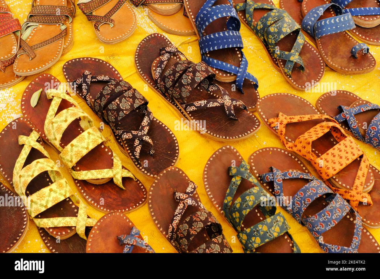 Colorful Handmade chappals (sandals) being sold in an Indian market ...