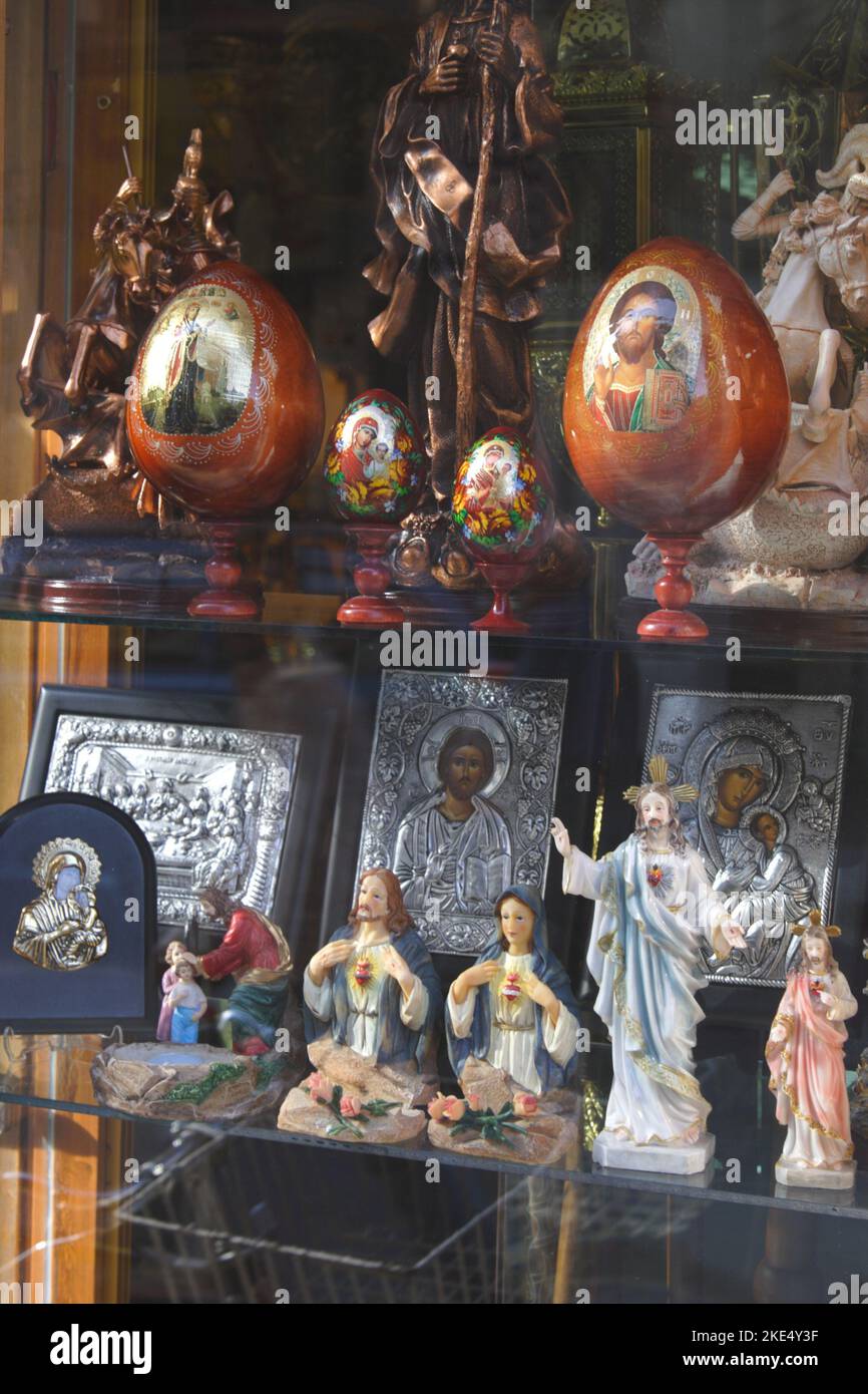 Shop window showing Christian religious figurines and other artifacts for sale, Damascus, Syria Stock Photo