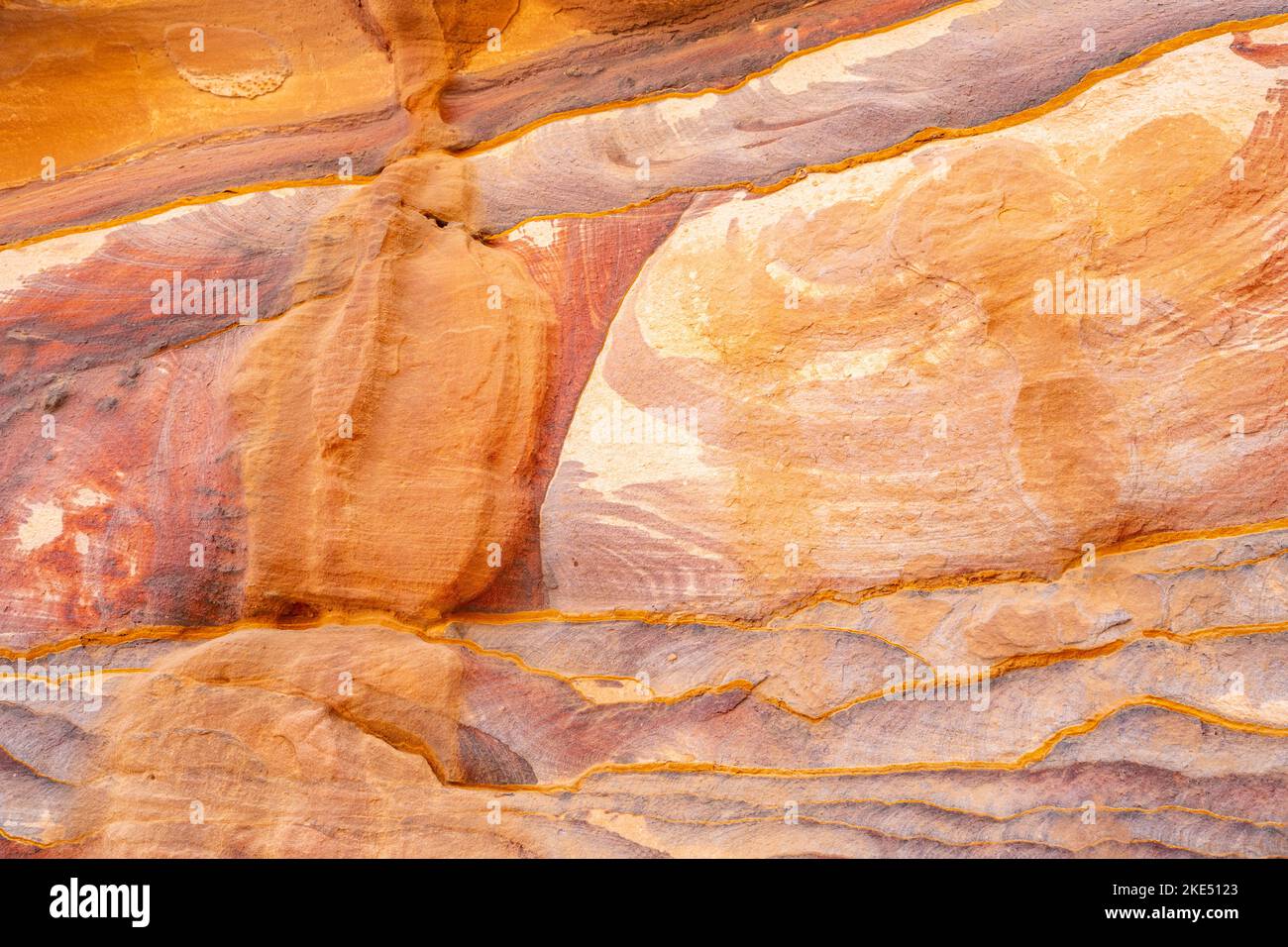 Colouresd rocks on the path to the monastery in Petra Jordan Stock Photo
