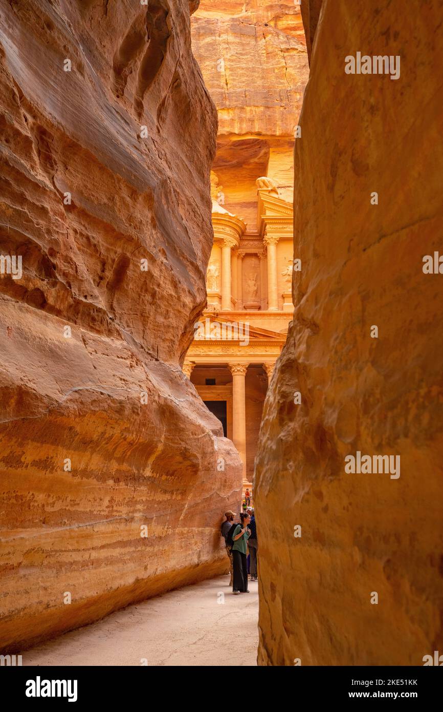The first glimpse of the treasury building at the end of As Siq, Petra Jordan Stock Photo