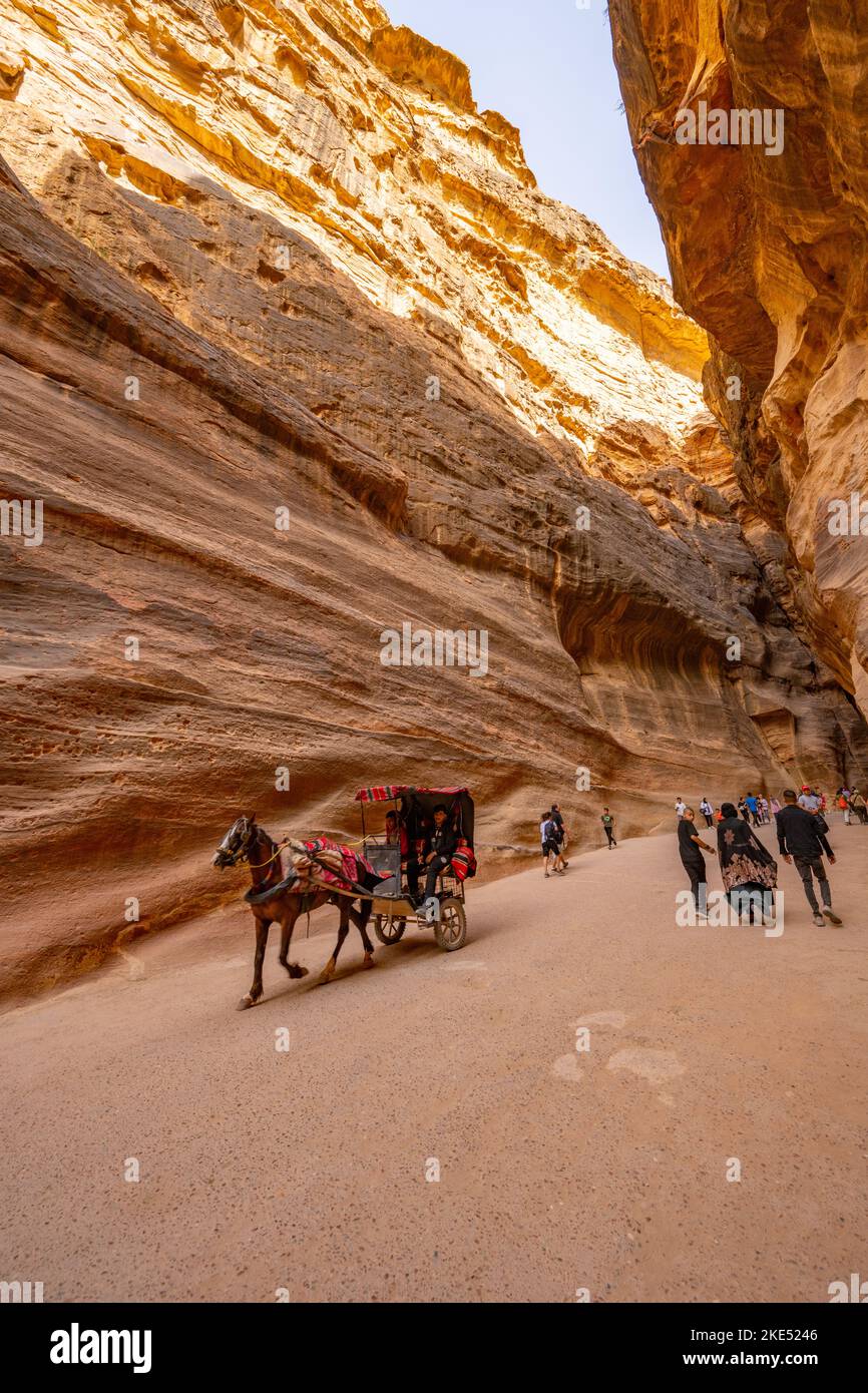 A Siq, the path through the rocks which is the entrance to Petra Jordan Stock Photo