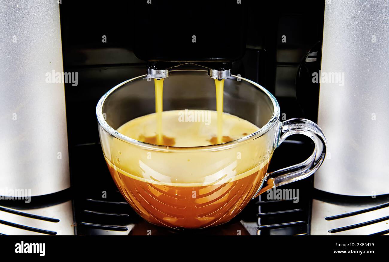 Closeup of modern fully automatic coffee maker machine outlet, one